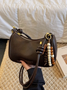 Retro dark brown crescent shoulder bag with bead charms and knotted strap design