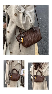 Detailed macro view of deep brown quilted bucket bag with woven bead charm accessory