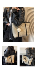 Detail of light grey tote bag with black leather straps and white plush ball charm