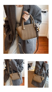 Detail of khaki woven texture bucket bag with beaded charm and adjustable strap