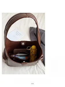 Interior view of brown leather tote bag with inner pocket and large capacity storage
