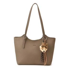 Brown lychee-texture tote bag with twin handles and a decorative teddy bear charm