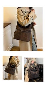 Détail du grand sac cabas en daim marron foncé avec boucle décorative et breloque en étoile