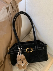 Elegant black suede underarm bag with contrast stitching and golden buckle detail