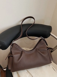 Deep brown pleated faux leather tote bag with side pockets and adjustable shoulder strap