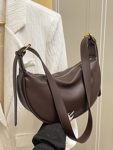Deep brown crescent shoulder bag in lychee texture leather with gold hardware detail