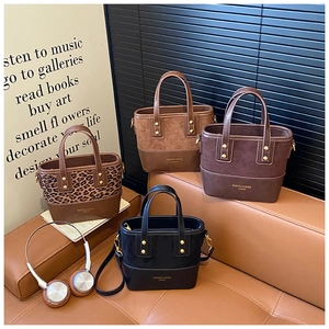 Detail view of mini leopard print tote bags in four colors with gold rivet accents
