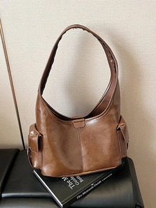 Vintage brown waxed leather tote bag with side pockets for daily commute