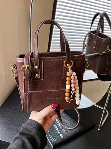 Vintage dark brown crossbody tote bag with bead charm and golden hardware detail