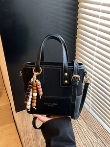 Retro leopard style black paneled handbag with vintage beads and chic gold hardware