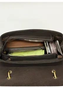 Top view of compact brown bag interior showing main compartment with zipper pocket