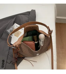 Macro shot showing the spacious interior storage of this brown suede patchwork handbag