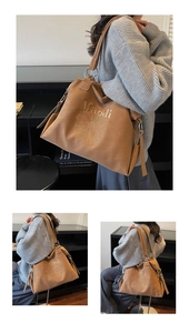 Detail of a large brown leather tote bag with daisy print and Maodi lettering