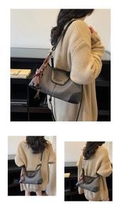 Detail of houndstooth crossbody bag with leather trim and plush bear charm accent