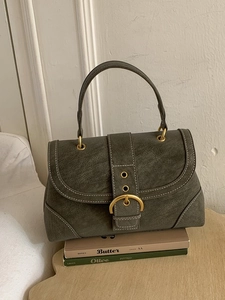 Vintage olive green handbag with white contrast stitching and gold circular buckle detail