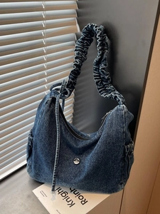 Vintage blue denim hobo bag with ruched shoulder strap and silver logo detail