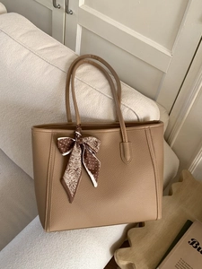 Brown lychee leather tote bag with silk scarf on handle for office commuting