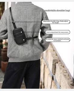Detailed back view of a black PU leather crossbody bag with adjustable nylon strap