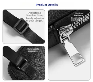 Detail view of black lychee grain leather crossbody bag with silver zippers and strap