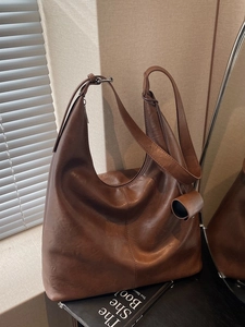 Retro brown large capacity hobo shoulder bag for women with cylindrical pendant charm