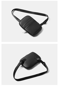 Front and back views of a black pebbled leather crossbody bag with silver hardware detail
