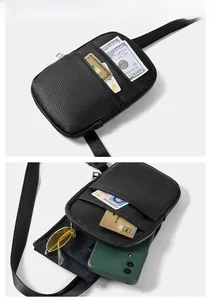 Detailed view of black litchi pattern bag showing multiple pockets and storage capacity