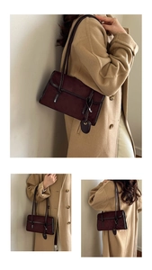 Detail view of burgundy suede hobo bag with flap closure and delicate shoulder strap