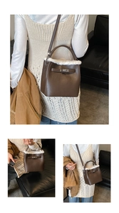 Detail of dark brown leather handbag featuring plush white faux fur trim and silver clasp