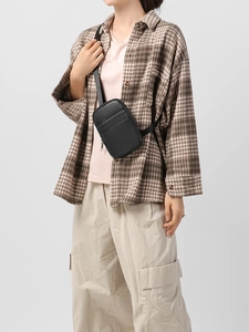 Minimalist black pebbled leather crossbody phone bag for women with thin strap