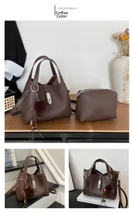 Detail view of coffee brown litchi pattern leather bucket bag set with plush charm