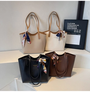 Detailed display of four textured tote bags in black, coffee, beige, and white colors