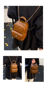 Detail of a brown quilted mini backpack with a silver metal turn-lock and chain straps
