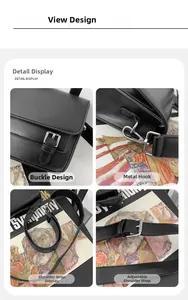 Detail of black leather crossbody bag featuring silver metal buckle and adjustable strap