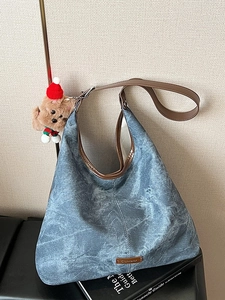 Retro washed denim hobo tote bag with brown leather straps and festive bear charm