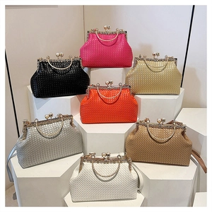 Detailed close-up of woven party clutches with metal clasps and chain handles