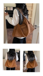 Close-up of large brown suede tote bag featuring delicate floral embroidery and Maodi logo