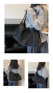 Close-up of black matte tote bag featuring embossed Maodi logo and linear patterns