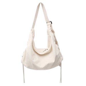 Minimalist canvas hobo bag in cream white with adjustable strap and drawstring details