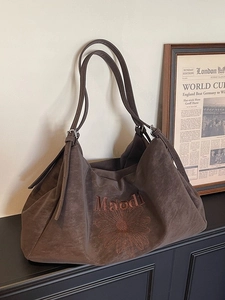 Large dark brown suede tote bag with flower embroidery and adjustable shoulder strap