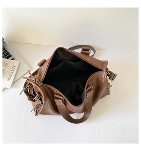 Brown retro pillow bag showing spacious interior compartments and functional drawstring