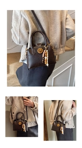 Detail of retro dark brown shell bag with metal lock, pearl charms and wooden beads