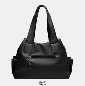 Back view of black litchi pattern tote bag showing rear zipper pocket and side pouches