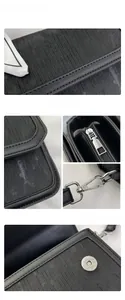 Detail of black crossbody bag featuring silver hardware and decorative silk scarf