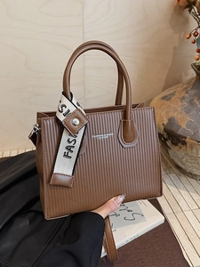 Brown textured small square bag with silk scarf handle and adjustable metal buckle