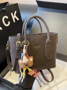 Vintage dark gray suede bucket tote bag with cute bear charm and adjustable shoulder strap