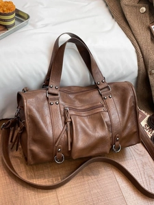 Brown vintage pillow bag with soft PU leather, rivets, and stylish shoulder straps
