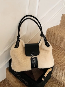 Minimalist winter faux fur tote bag in beige with black leather trim and silver buckle