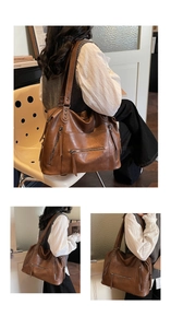 Detail view of large brown retro bowling tote bag with functional zippers and metal rivets