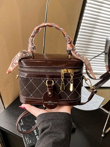 Elegant coffee brown quilted box bag with silk scarf handle and polished hardware details