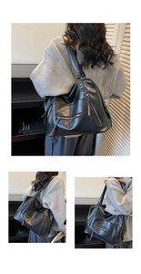 Detail view of large capacity black PU leather shoulder bag with multi-zipper pockets